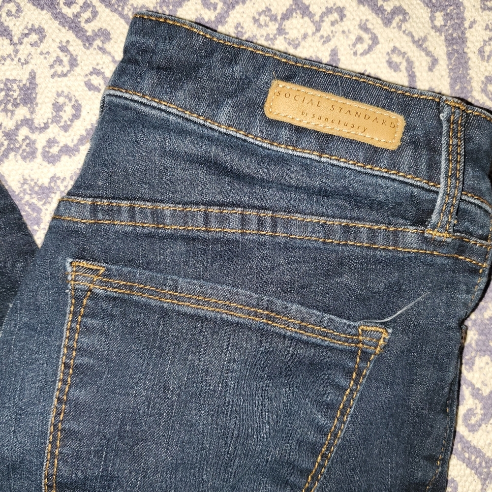 High-rise dark wash skinny jeans.